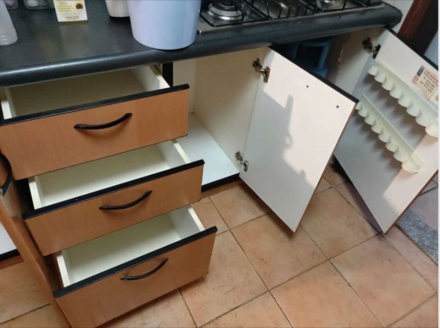 Kitchen cabinet drawers and doors opened up for bio-cleaning
